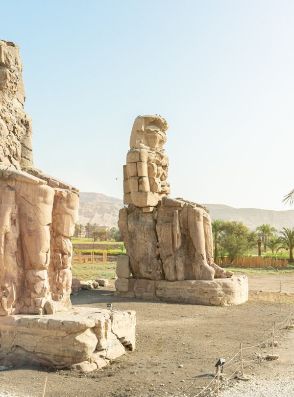 Two ancient egyptian statues of a pharaoh