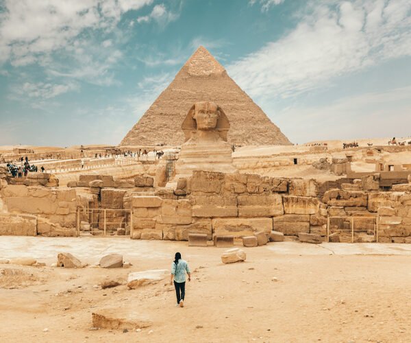a-wonderful-shot-of-the-traveler-in-front-of-the-pyramids-of-giza